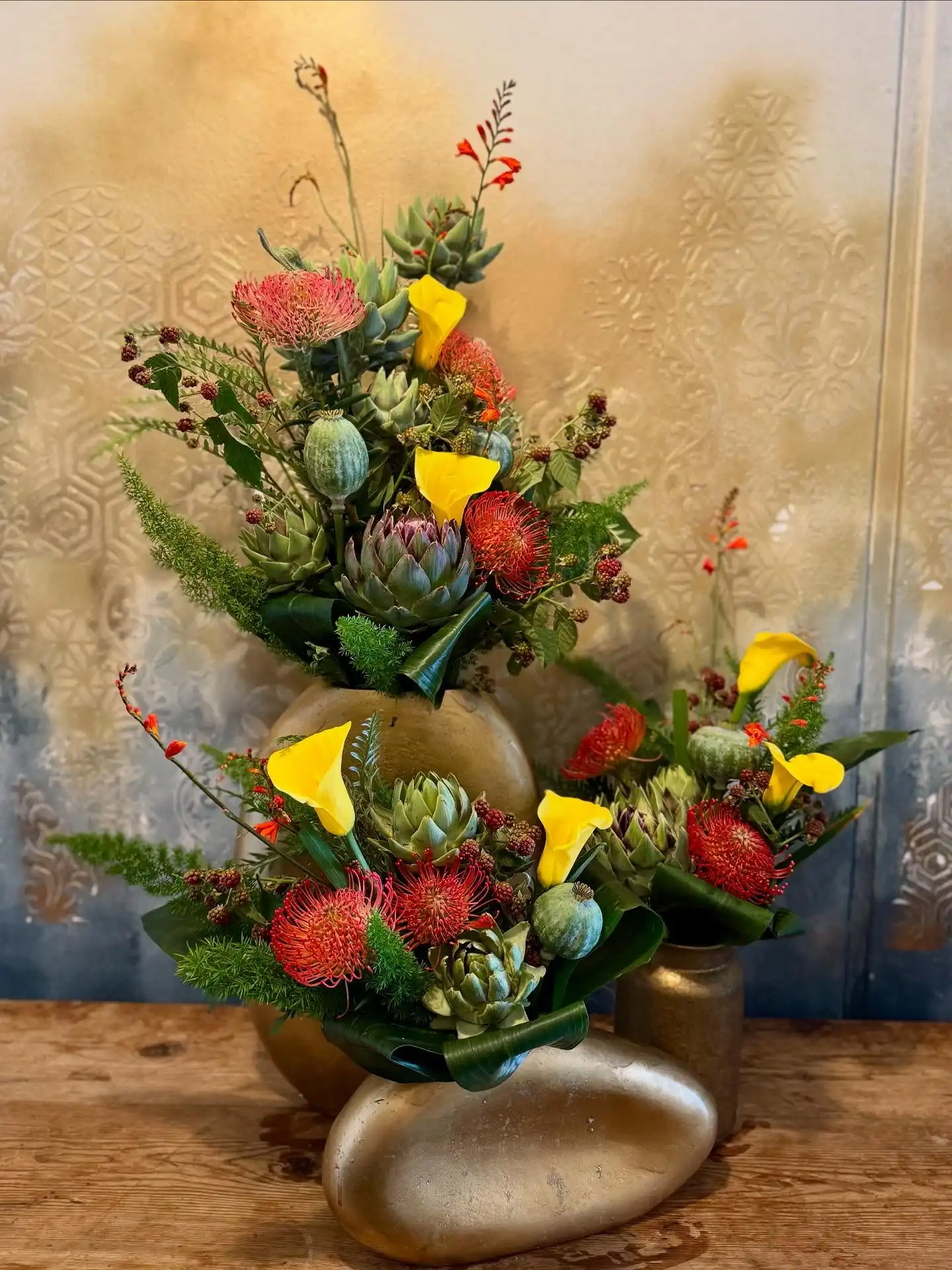 We are just loving artichoke season. We’ve arranged them with yellow calla lilies and orange pincushions to create these beautiful, textured arrangements to brighten up our Monday morning hotels and offices.

Blooming Amazing Flower Company
Gold Award Winner - Flower Shop of The Year

38 Ranelagh Village
Dublin 6 
D06 E4H3
Ireland
Tel : + 353-1-491 0233

Web : www.bloomingamazing.ie
Email : info@bloomingamazing.ie
.
.
.
#hoteldecor #officedecor #artichokes #callalily #pincushion #officearrangements #bloomsoftheday #smallbusiness #floristsofinstagram #floraldesigns